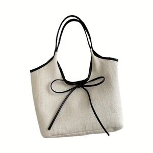 Elegant Cream Tote Bag with Black Bow